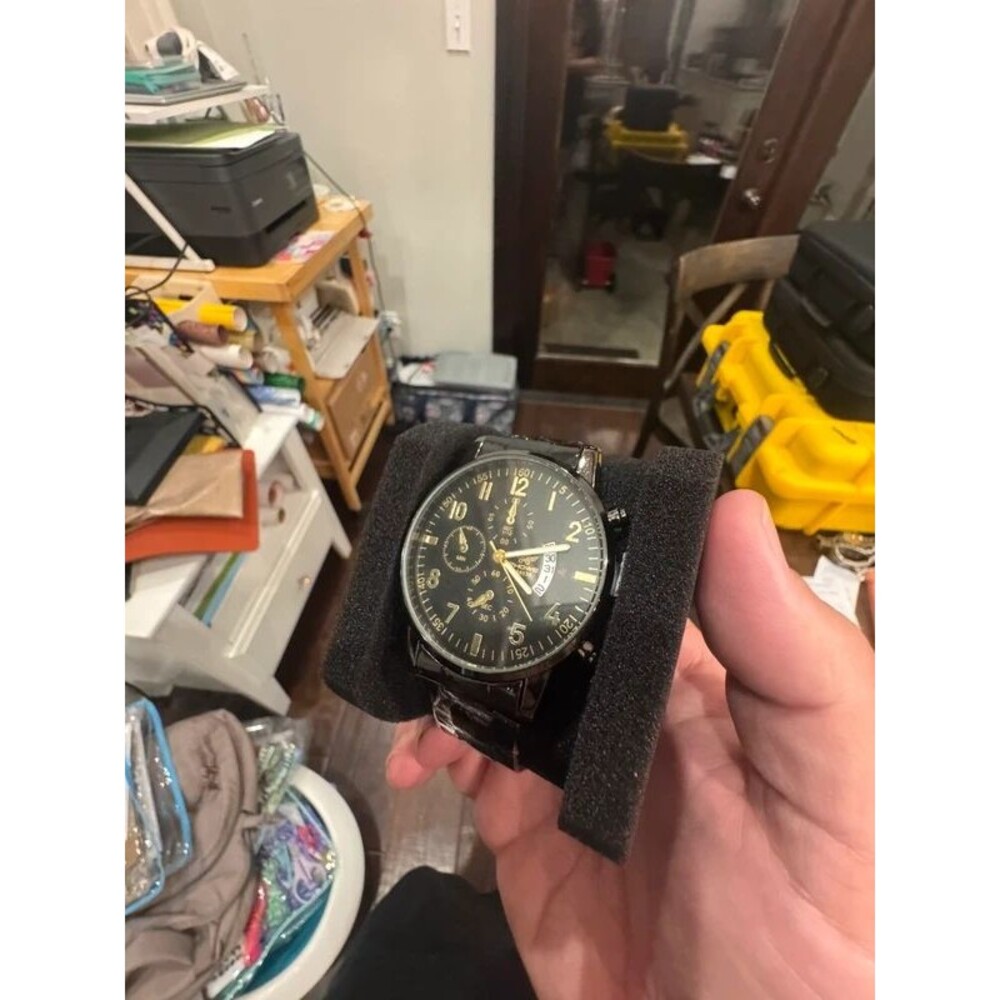 Budget black on black watch with gold